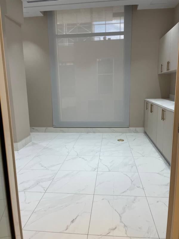 Unfurnished commercial interior with marble tile and large window at Town Center Costa del Este Panama