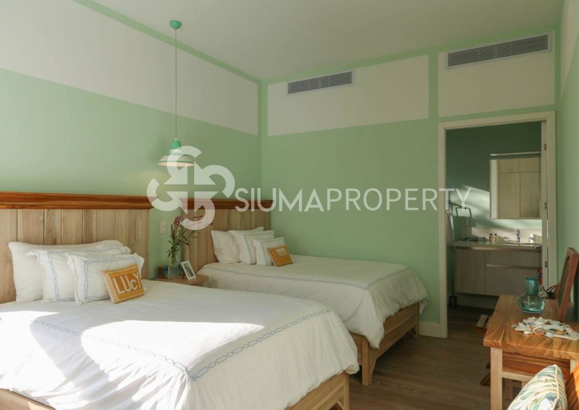 Bedroom with panoramic sea view large glass windows and natural light in Pearl Island residence