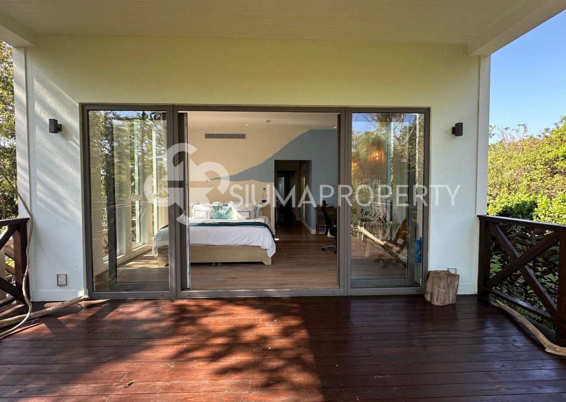 Spacious bedroom with wooden flooring, tropical island views in Pearl Island Panama