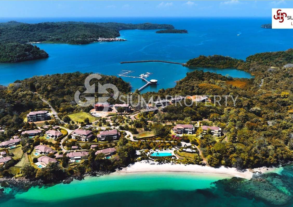 Aerial shot showing beach, marina and private villas of Pearl Island Panama
