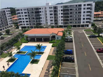 Aerial shot apartment complex with pool, club house, gardens Panama Pacifico Midrise