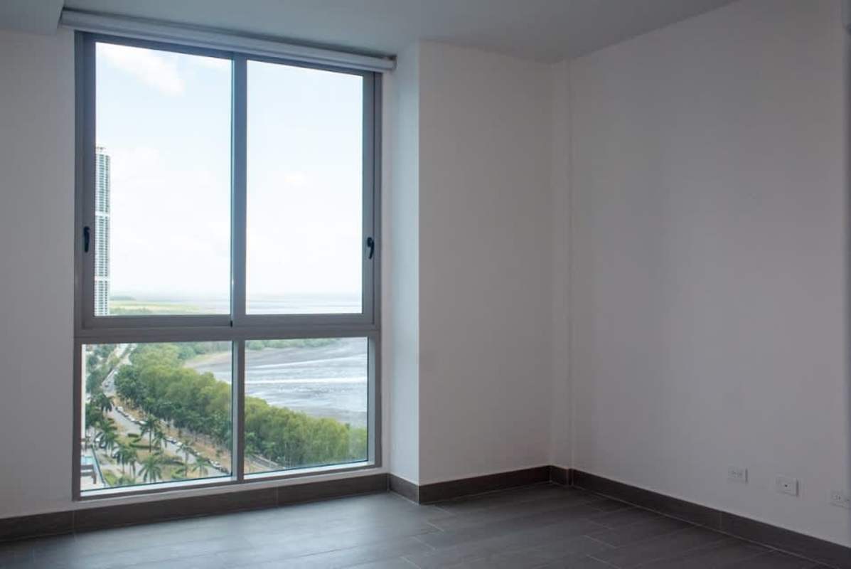 Italian design kitchen with island, wood accents, white cabinetry in PH Regalia luxury apartment Costa del Este Panama
