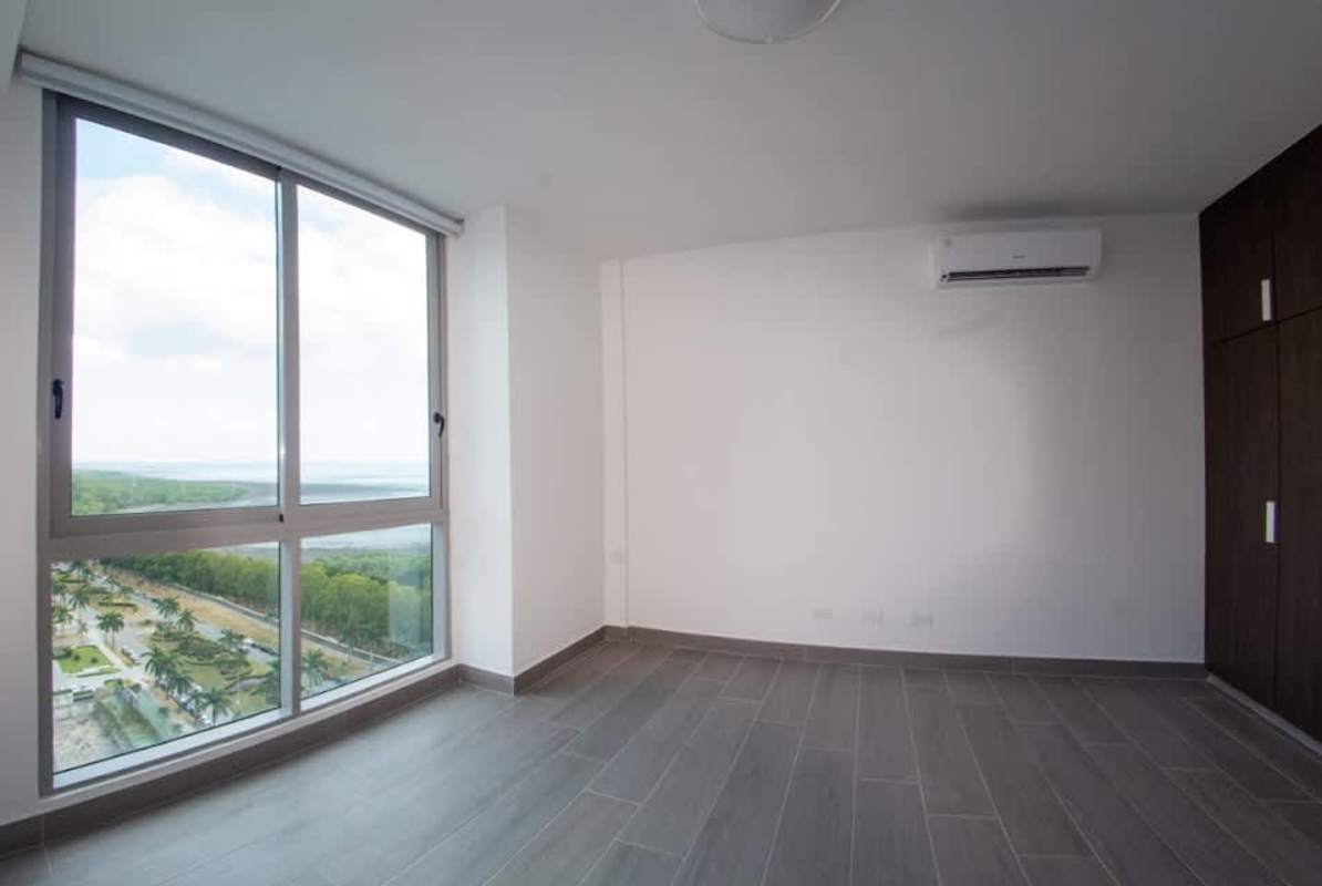 Bedroom with floor to ceiling window and ocean views in PH Regalia Costa del Este Panama City