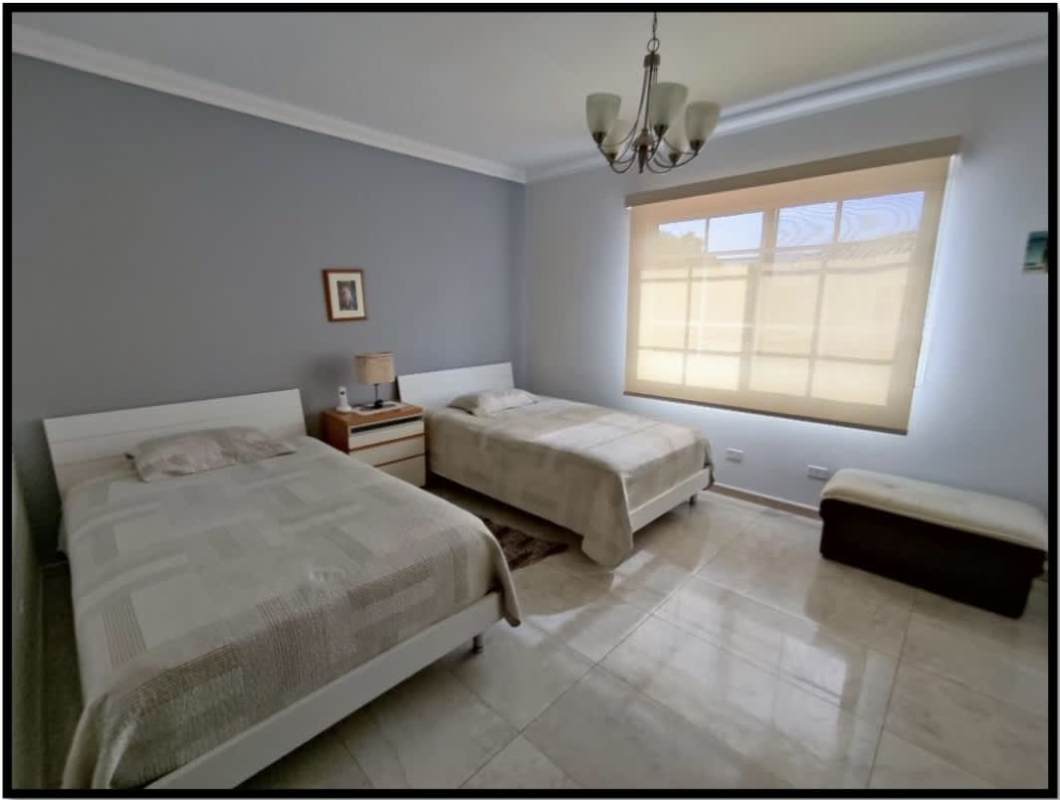 Backyard with private swimming pool, hot tub, rock waterfall, patio at Palmeras del Este Costa del Este Panama