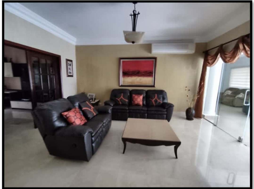 Spacious living room with leather sofas, glass doors, recessed ceiling Palmeras del Este Costa del Este Panama
