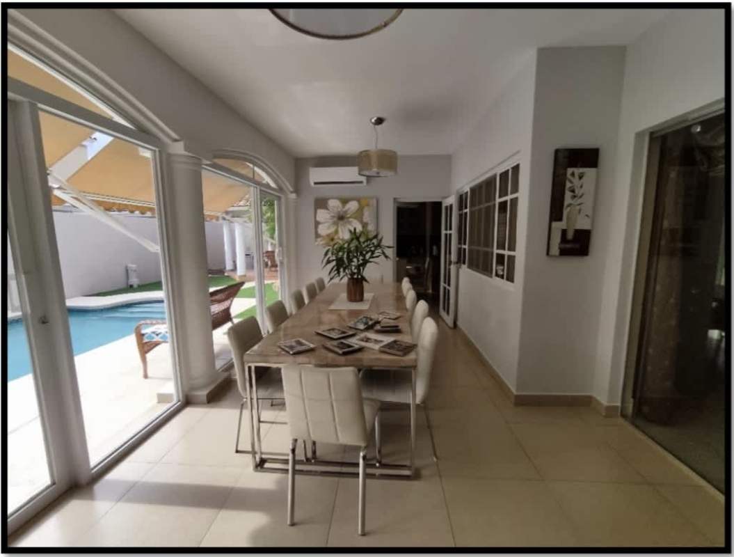 Spacious foyer with marble flooring and wrought iron staircase at luxury house Palmeras del Este Costa del Este