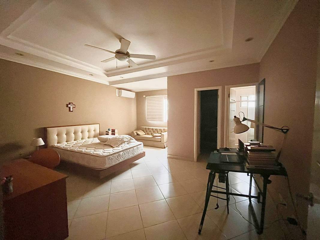 Spacious bedroom with tiled floor, ensuite bathroom, large windows Obarrio Panama