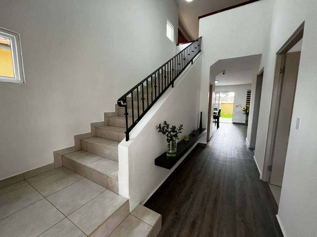 Covered terrace with BBQ zone and garden in PH Villa Alta Panama Brisas del Golf