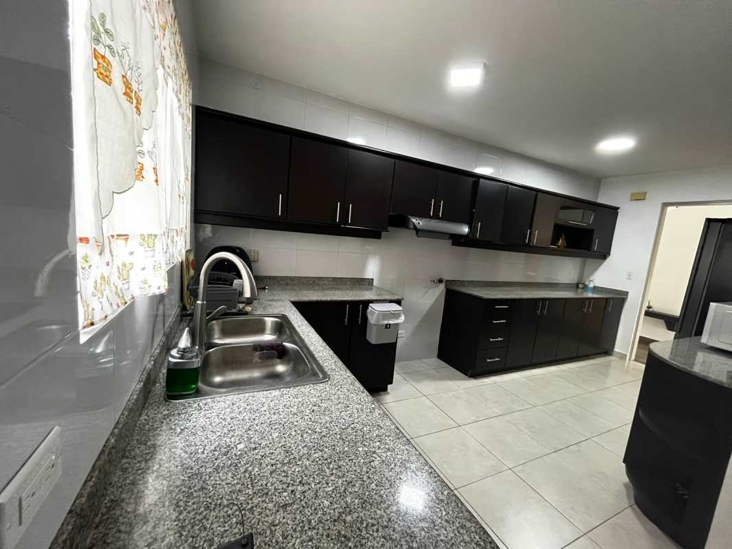 Living and dining room with glass doors to terrace in PH Villa Alta Panama City