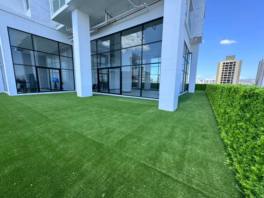 Contemporary lobby with sofa, glass doors and marble floors at PH Centerpoint Panama City