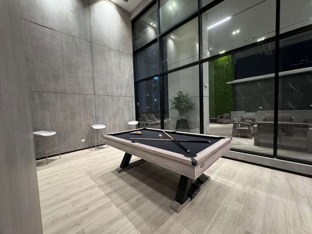 Game room with pool table, high ceiling, floor to ceiling windows at PH Centerpoint Panama