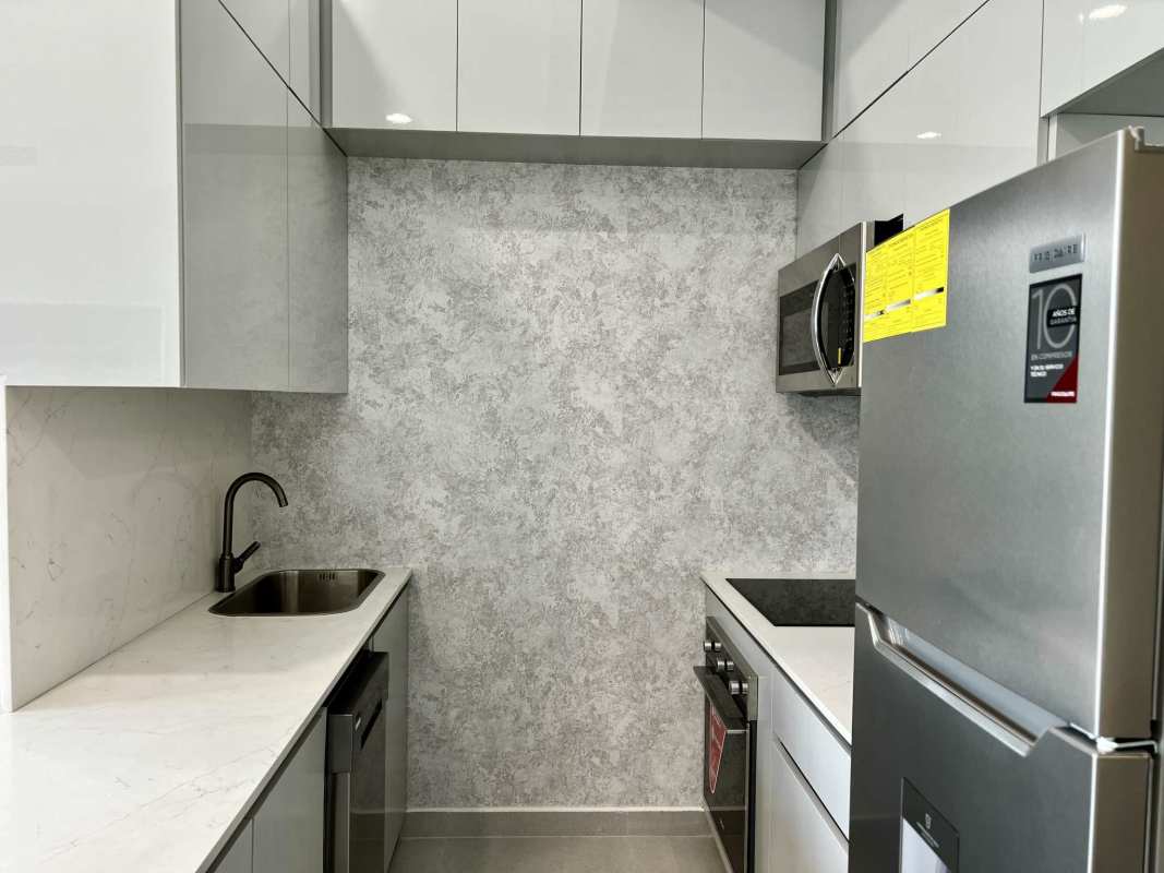 Bright bedroom with large windows and city views in Bella Vista Panama