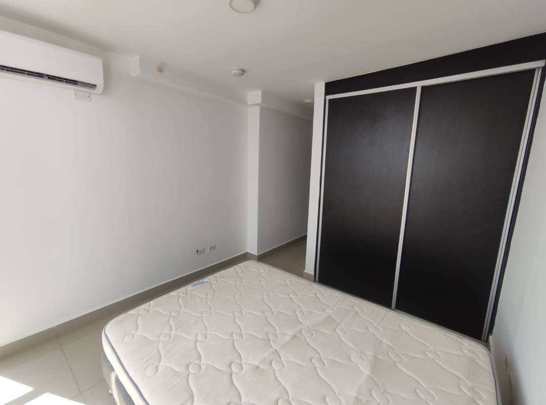Modern bedroom with AC and black sliding closet doors PH Coral Tower Panama