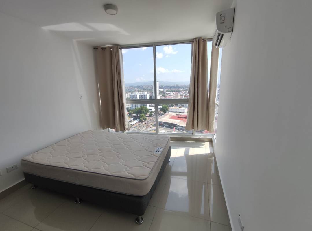 Bedroom with large window city view blinds AC PH Coral Tower Panama City