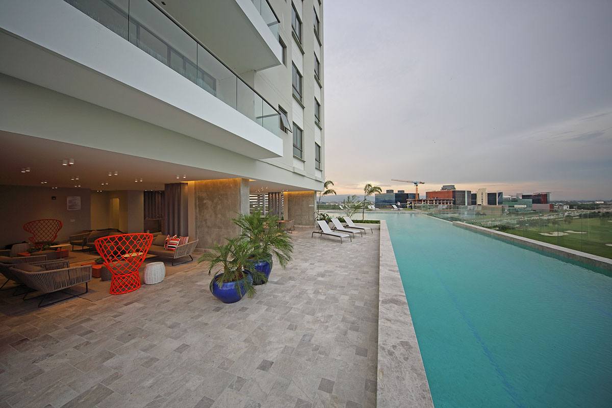 Luxury condo kitchen with modern island and stainless appliances in PH Oceana Santa Maria Panama