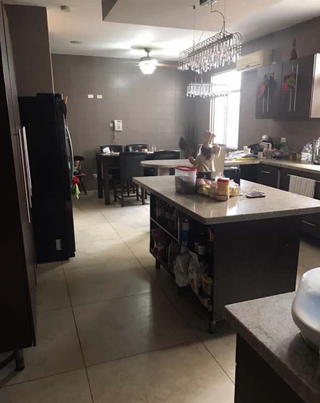 View from balcony overlooking residential neighborhood and hills in Altos de Panamá Panama