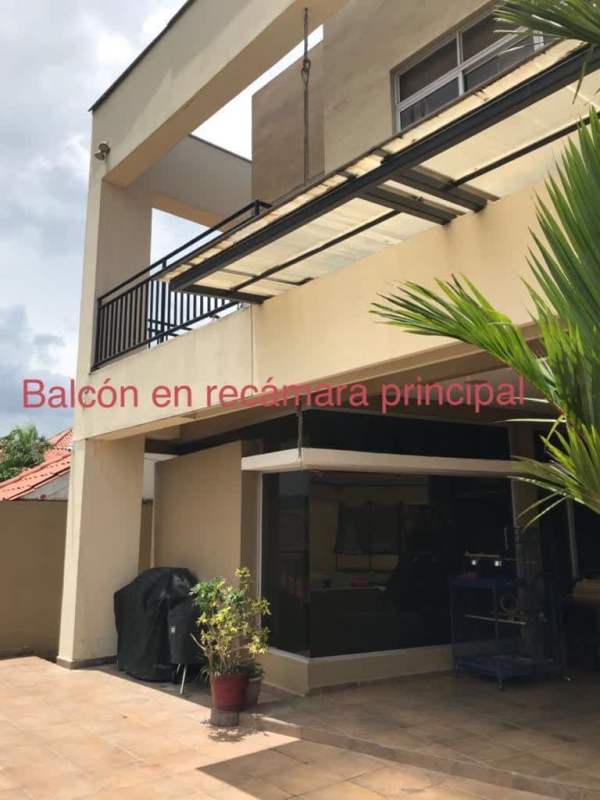 Modern interior staircase with floating steps and wall art in Altos de Panamá home Panama