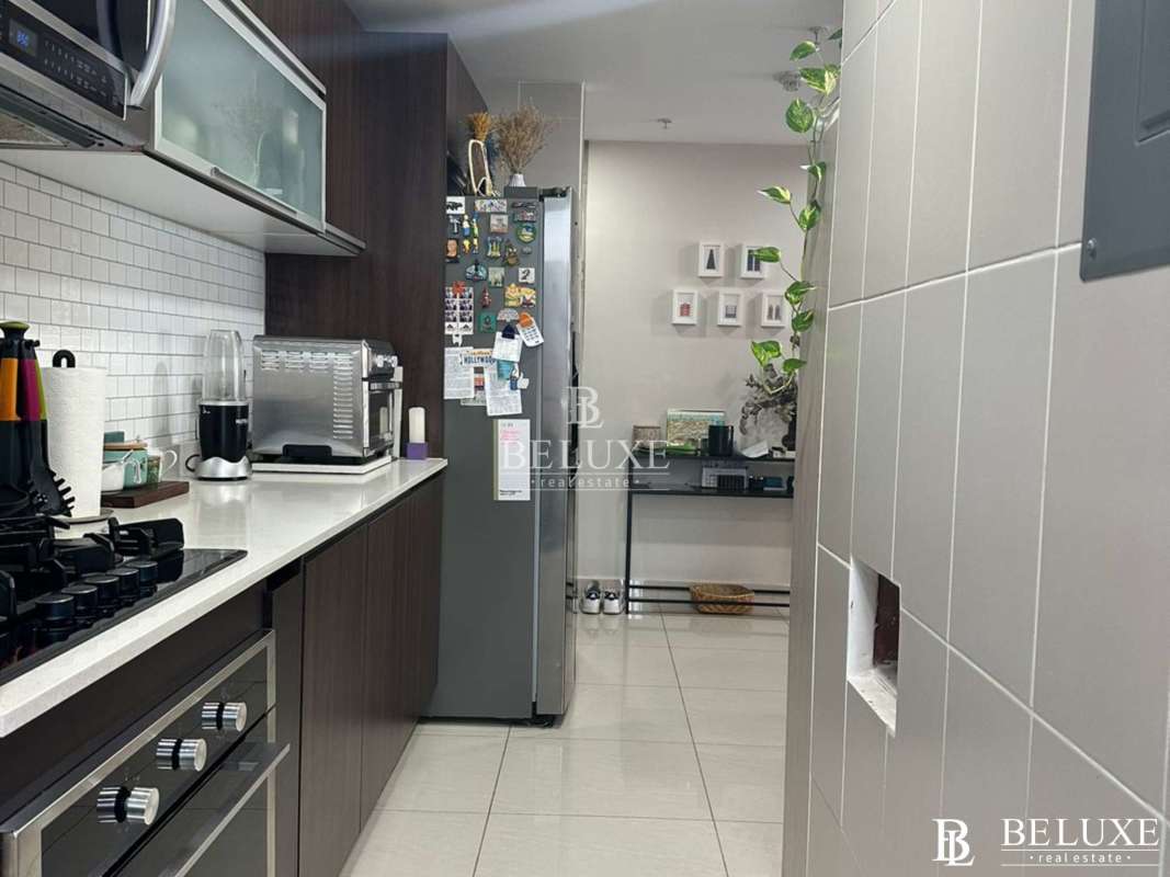 Spacious open-plan living and dining with panoramic window PH Genesis Tower San Francisco Panama