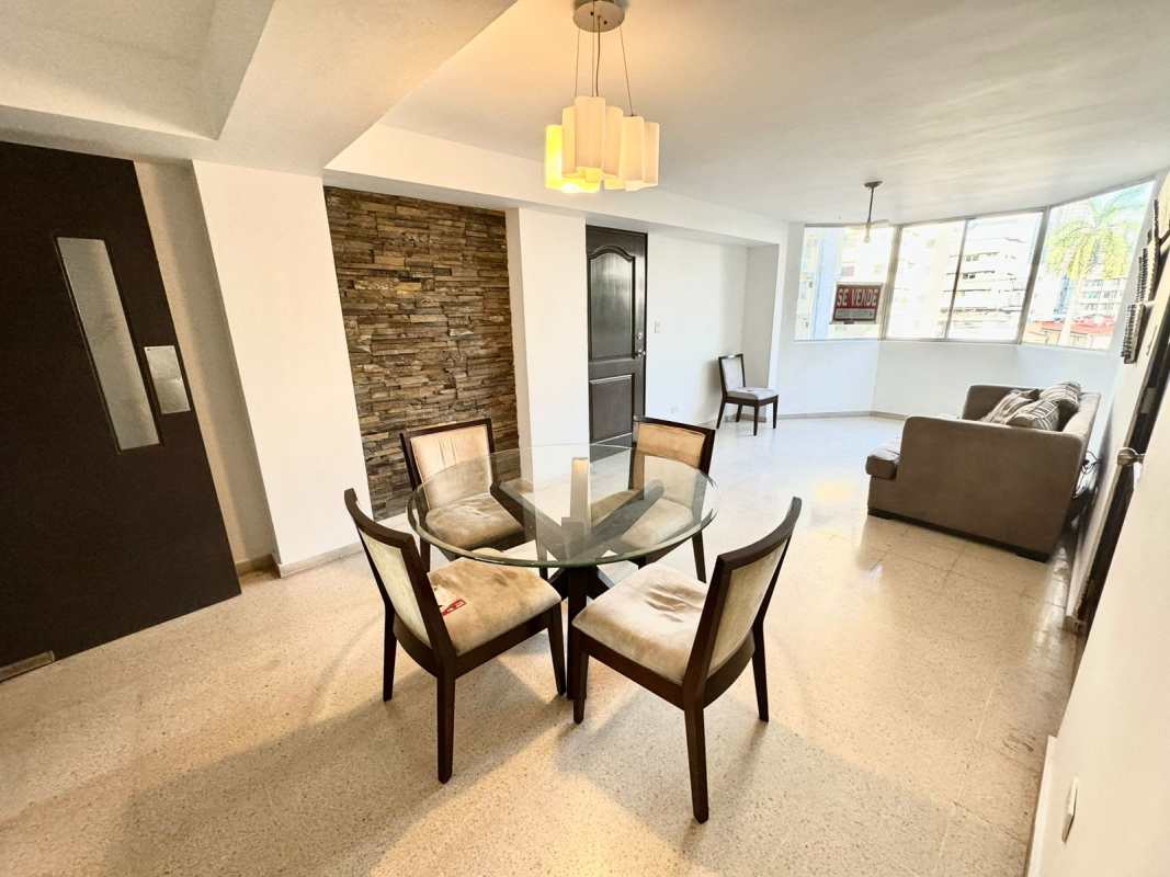 Bedroom with colorful bedding, ceiling fan, AC, large windows PH Arcelia Panama