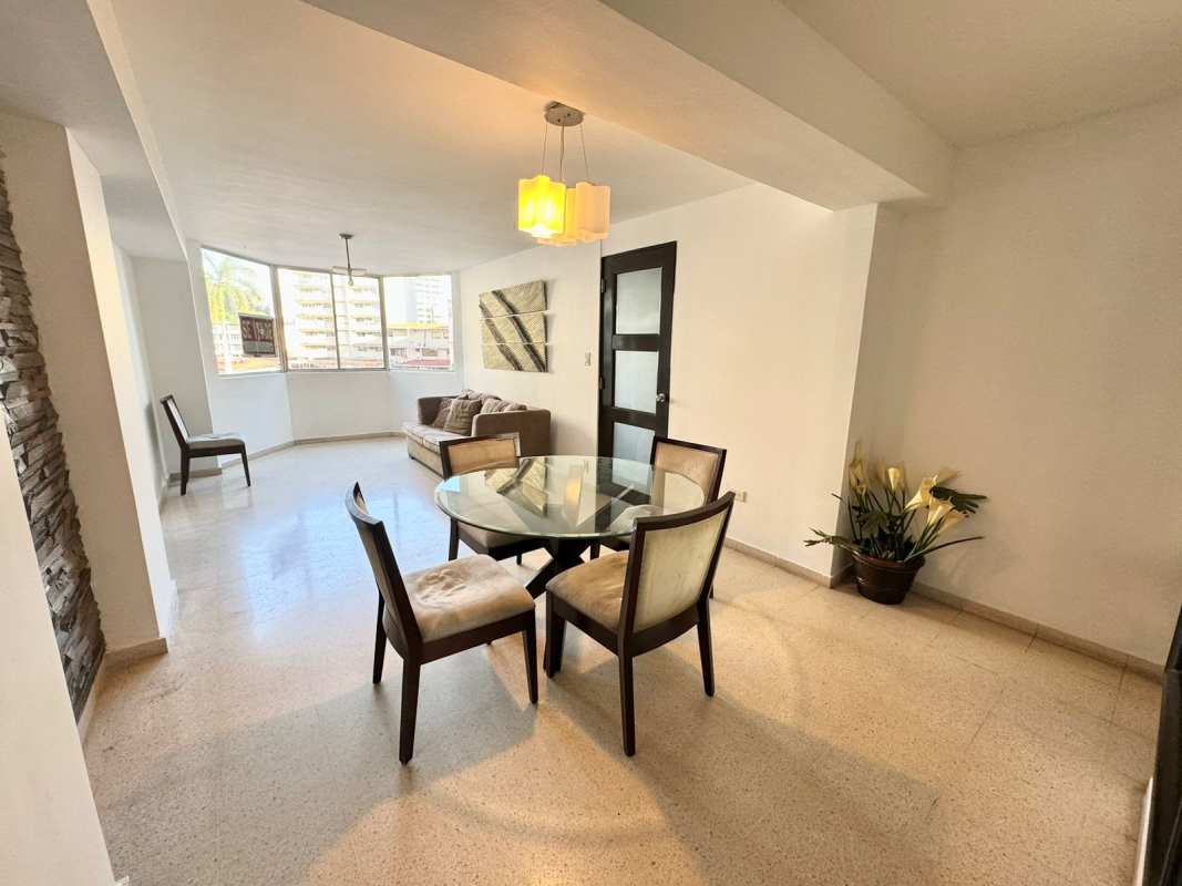 Open living dining with stone accent wall and modern lighting PH Arcelia in Bella Vista Panama City