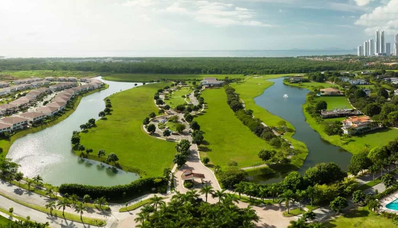 Panoramic aerial of Peninsula Estates waterfront and golf community near coast Panama City