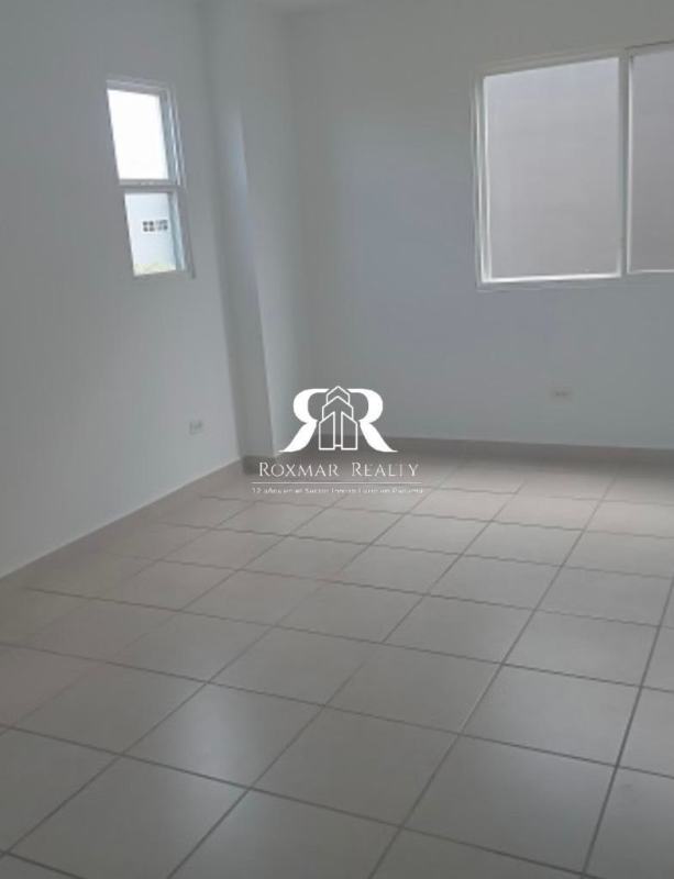 Minimalist empty living room space tiled flooring frosted window Brisas del Golf Panama