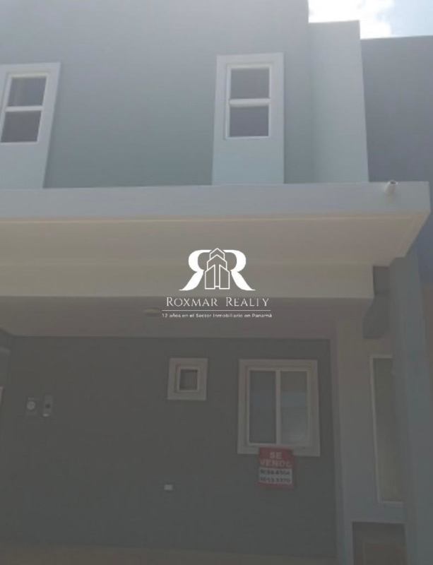 Exterior front view of two-story modern house for sale in Brisas del Golf Panama