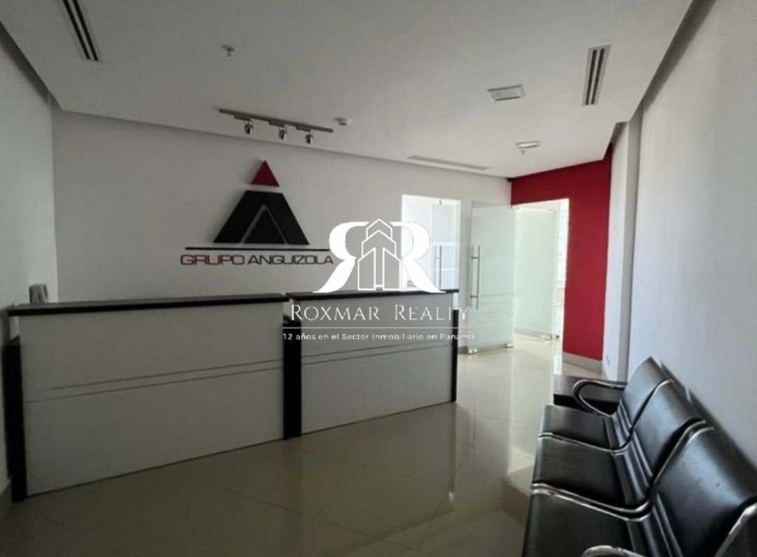 Contemporary office reception area with illuminated logo and seating, PH BICSA Tower Panama