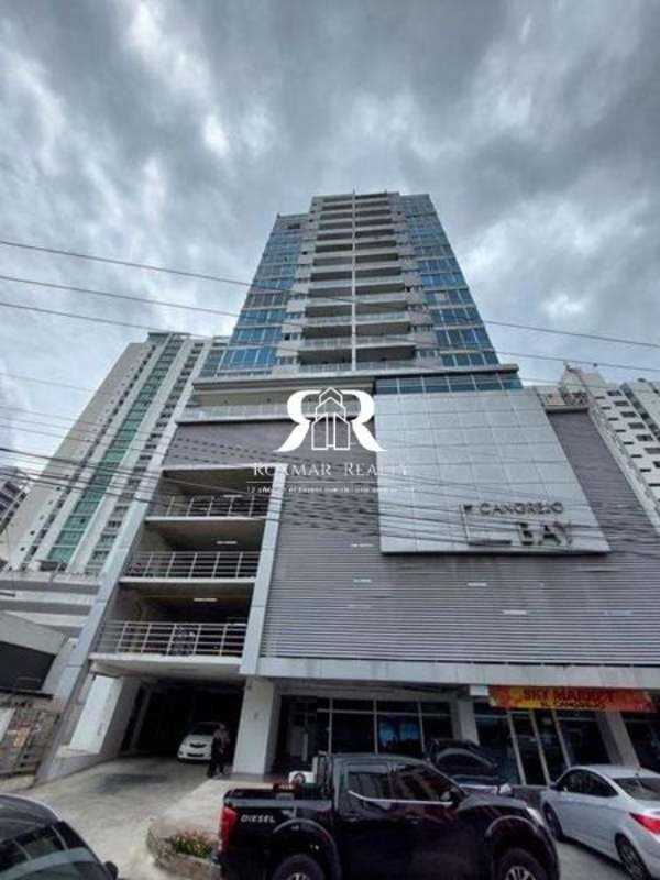 Mixed-use high-rise tower with glass facade and retail spaces in El Cangrejo Panama City