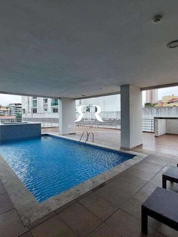 Outdoor covered swimming pool deck with lounge chairs in PH El Cangrejo Suites Panama