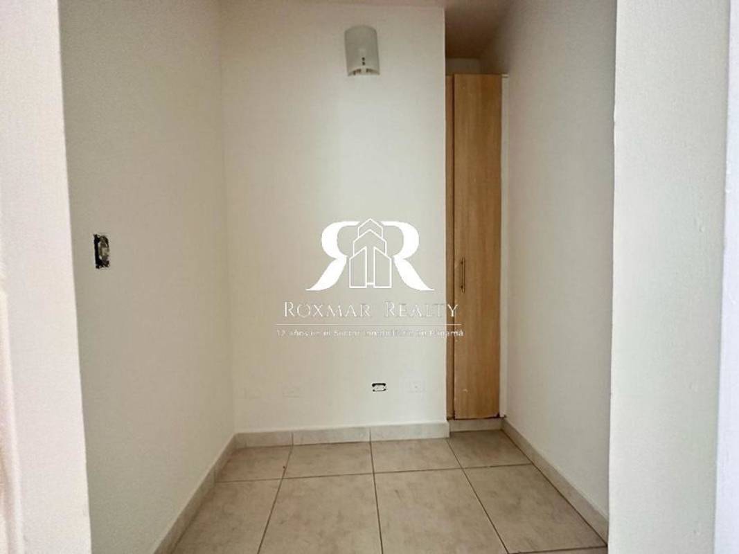Storage room tile floor white walls wood cabinet PH Lexington Tower El Cangrejo Panama City