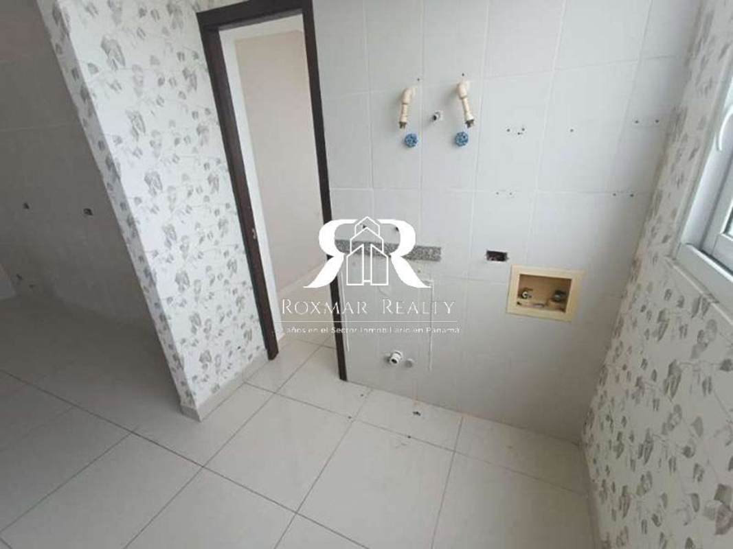 Dedicated laundry space with tile walls, plumbing connections, window PH Quartz Tower San Francisco Panama