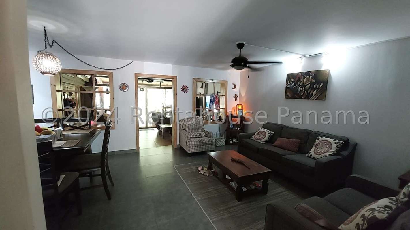 Living and dining room open plan with natural light and tile floors in Clayton Panama house for sale