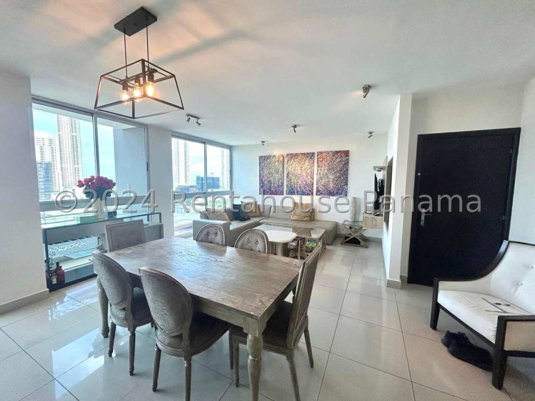 Open-plan living and dining room with large windows city skyline at PH LaCosta Tower Costa del Este