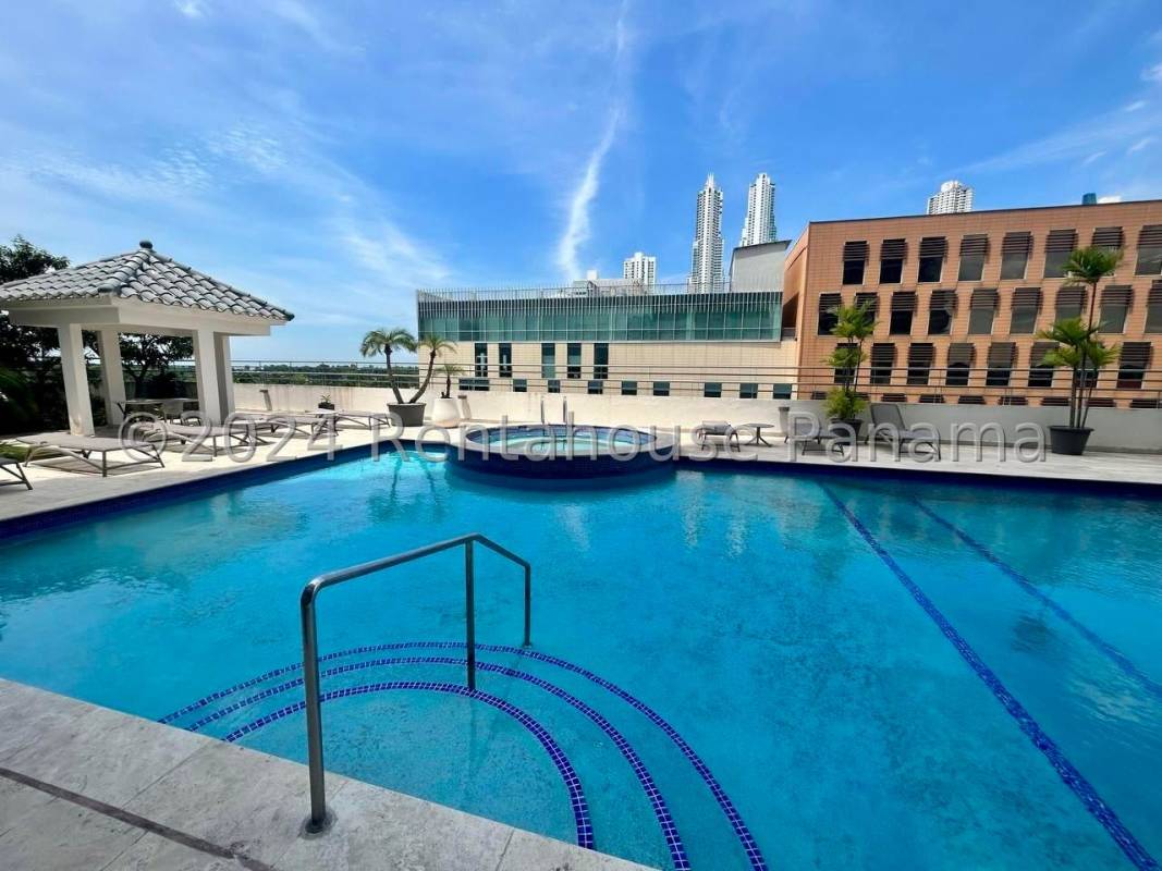 Master bedroom with large windows, en suite bath and ocean skyline view in PH LaCosta Tower Costa del Este Panama