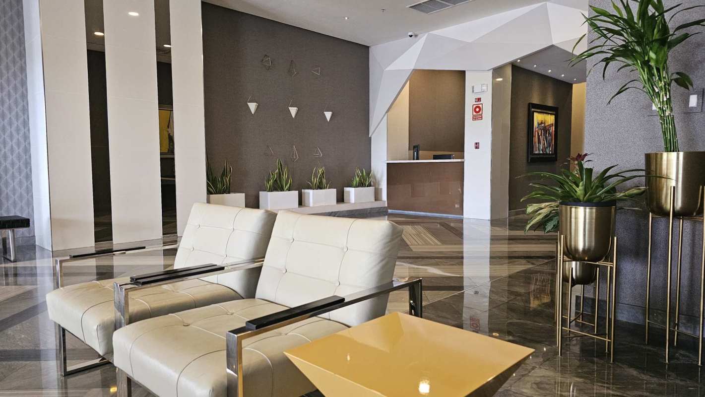 Spacious lobby with art decor, marble floors, modern seating in Parkside Panama