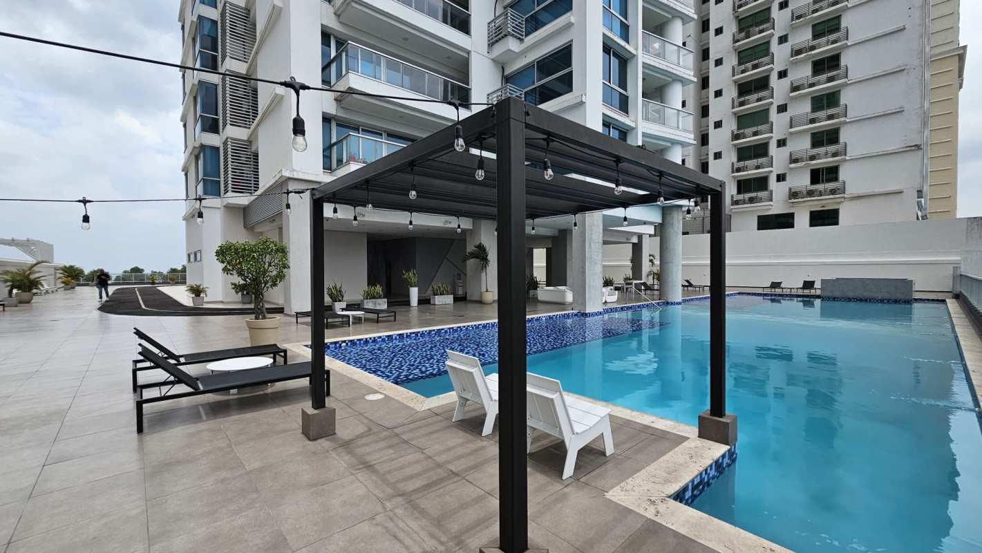 Rooftop infinity pool deck with skyline and ocean views in PH Parkside Panama