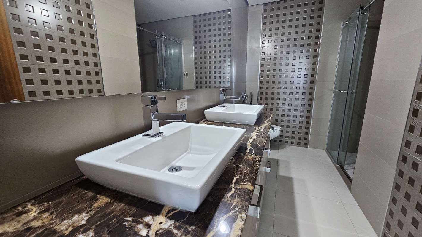 Luxury bathroom with marble vanity, vessel sinks and glass shower PH Parkside Costa del Este