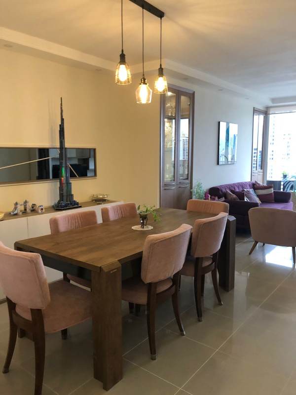 Furnished living-dining space with city views and balcony PH Obarrio 66 Panama