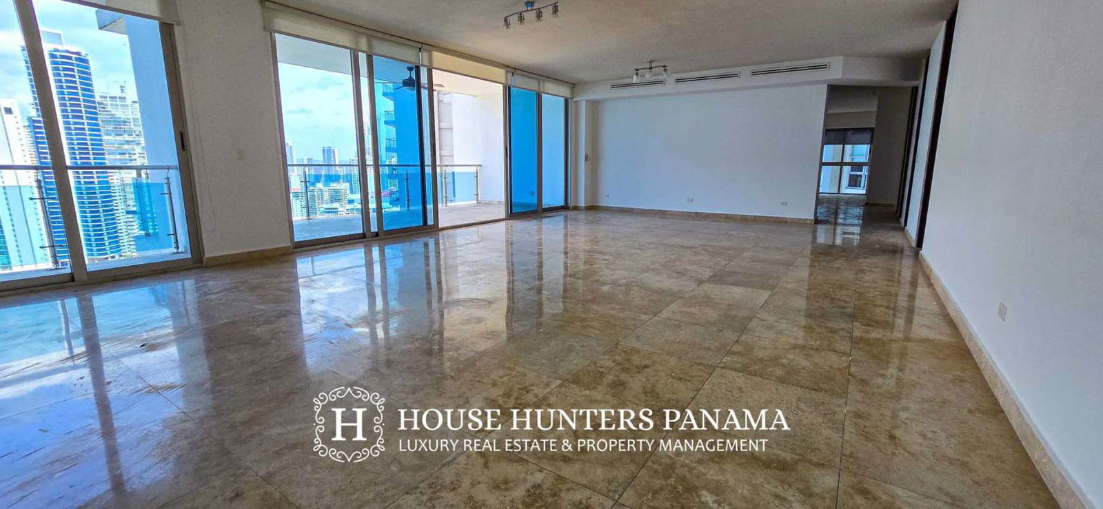 Large private marble terrace balcony with panoramic Pacific Ocean skyline view in PH Aqualina