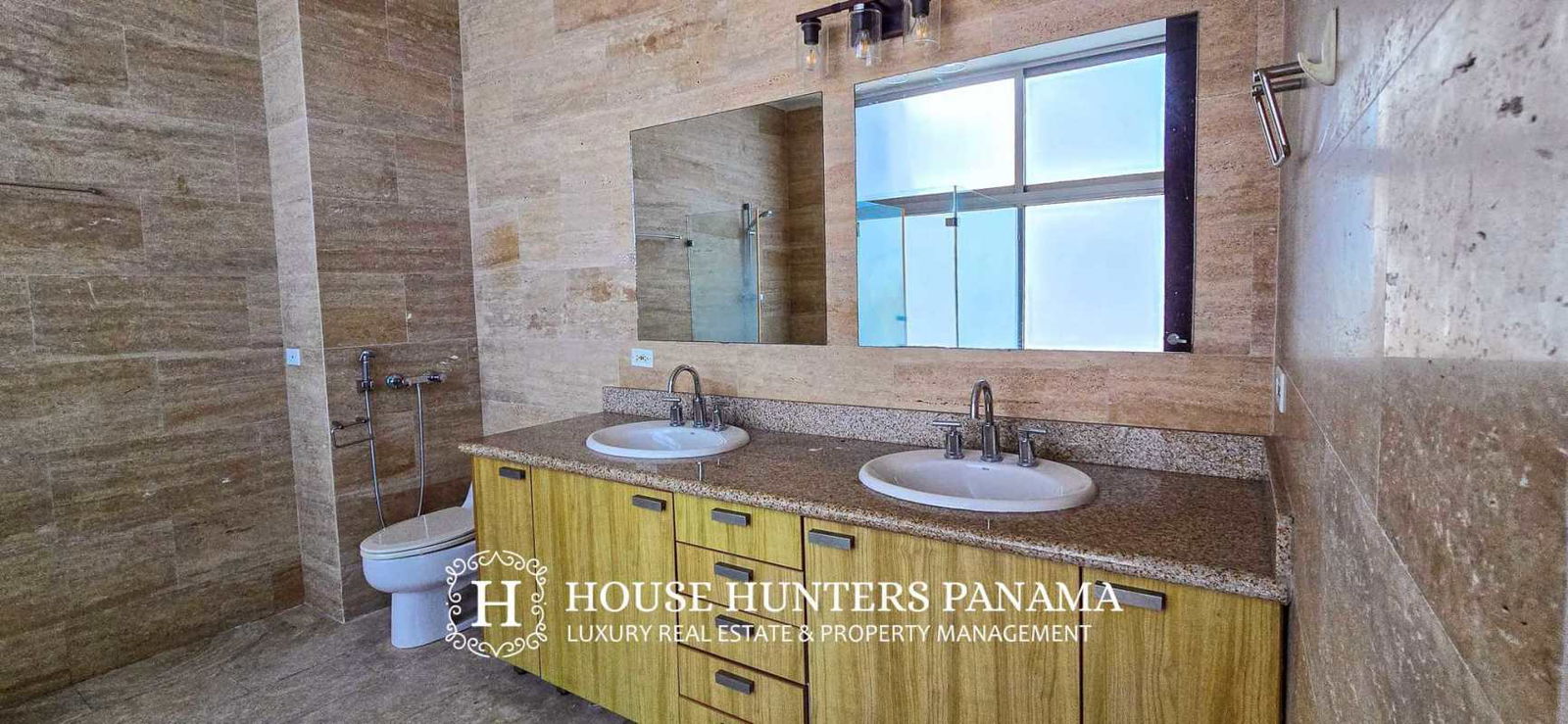 Dining space connected to living room with panoramic city and ocean views PH Aqualina Panama City