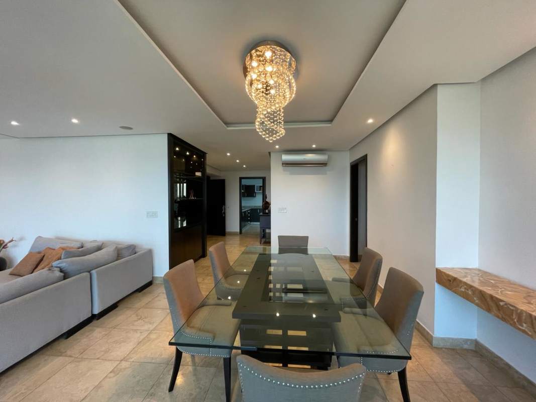 Kitchen with granite countertops dark wood cabinets stainless appliances PH Titanium Panama