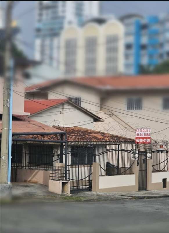 Simple kitchen with granite countertops, gas stove and barred window Bella Vista Panama house for rent