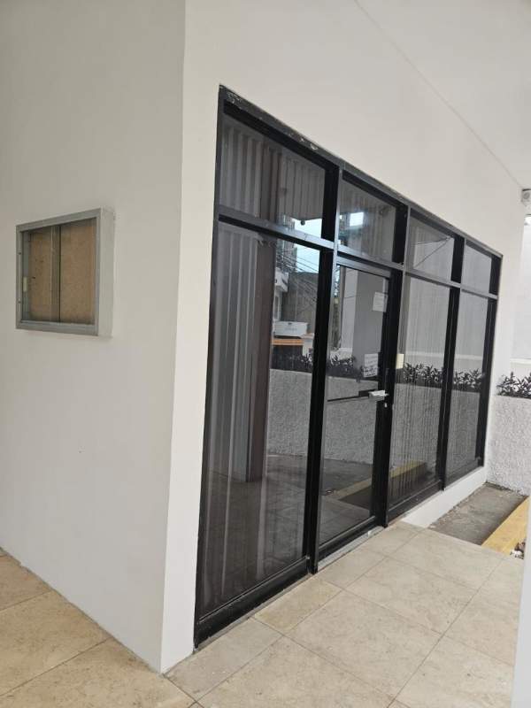 Ground level glass storefront entrance PH Bella Tower commercial property Bella Vista Panama