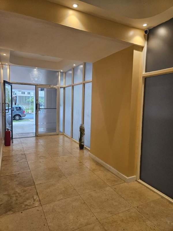 Lobby entrance with frosted glass, security desk PH Bella Tower Bella Vista Panama