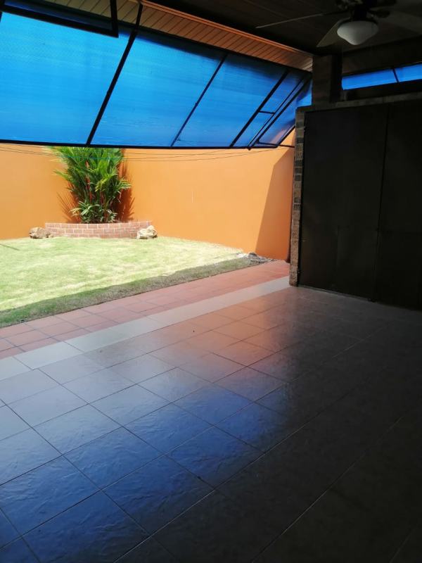 Minimalist bedroom with checkered bed tiled floor PH Versalles Costa Sur