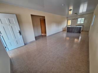 Bathroom with vanity walk-in shower beige tiles new house Santa Clara Panama