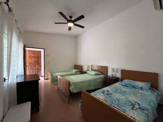 Traditional kitchen with wood cabinets and appliances in Playa Corona beach house San Carlos