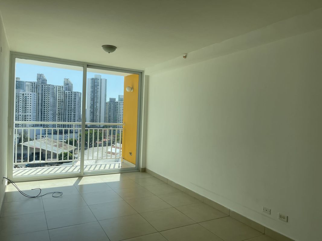 Open concept living dining room with balcony access in PH Sole Tower Hato Pintado Panama City