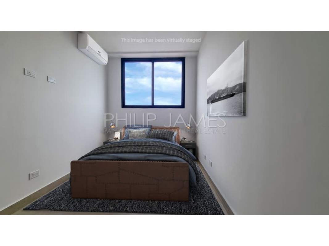 Bright L-shaped modern kitchen granite countertops large window in Cranc Tower Panama City